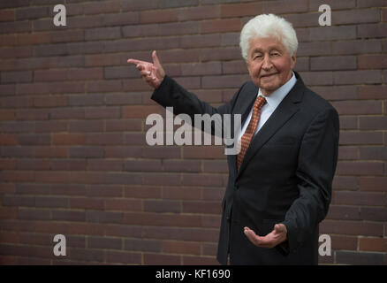 Stuttgart, Germany. 24th Oct, 2017. Choir director Gotthilf Fischer standing at a terrace in Stuttgart, Germany, 24 October 2017. For 7 decades Gotthilf Fischer has been bringing choir music to Germany's turntables. His music label awarded the composer and director of the Fischer Choir with a golden record for '70 years of recording'. Credit: Marijan Murat/dpa/Alamy Live News Stock Photo