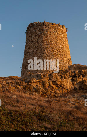 Corsica, Ile-Rousse (Red Island): sunset on the Genoese Tower built in the 15th century on the top of the Ile de la Pietra (Stone Island), promontory Stock Photo