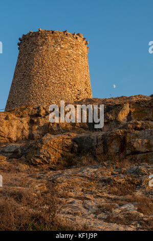 Corsica, Ile-Rousse (Red Island): sunset on the Genoese Tower built in the 15th century on the top of the Ile de la Pietra (Stone Island), promontory Stock Photo