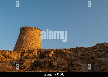 Corsica, Ile-Rousse (Red Island): sunset on the Genoese Tower built in the 15th century on the top of the Ile de la Pietra (Stone Island), promontory Stock Photo