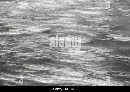 Abstract Silver and White Ocean Surface in Motion Stock Photo