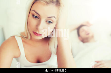 awake woman having insomnia in bed Stock Photo