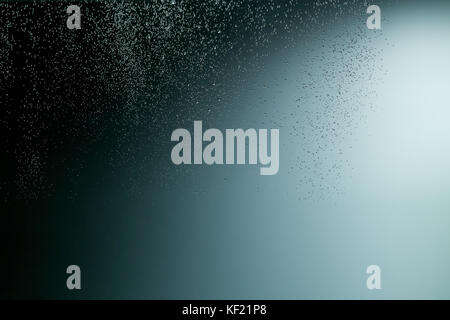 Soft light gradation in deep dark water with hundreds of small air bubbles Stock Photo