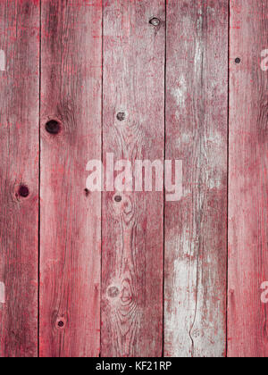 Rustic red weathered barn wood board background showing rich grain and knots Stock Photo