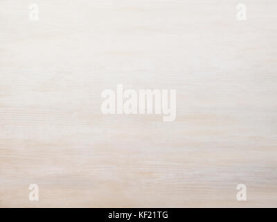 Subtle near white pickled cool tan wood board surface shows subtle grain fade to white Stock Photo