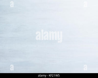Subtle near white pickled blue grey wood board surface shows subtle grain fade to white Stock Photo