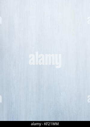 Subtle near white pickled blue grey wood board surface shows subtle grain fade to white Stock Photo