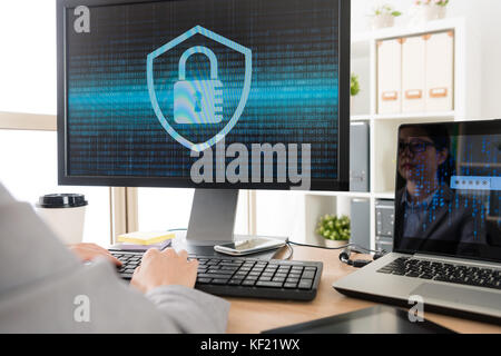 closeup photo of businesswoman using computer working and developing online cyber security system. Stock Photo
