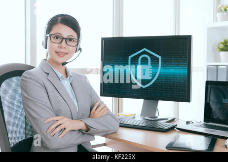 professional women right office worker working in information security company service center and looking at camera smiling. Stock Photo