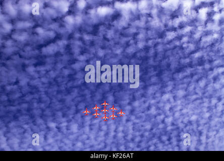 The Red Arrows (RAF Aerobatic team) against a dapple sky. Stock Photo