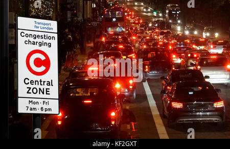 Rush hour on London streets, Evening traffic jam, congestion charging sign post present Stock Photo