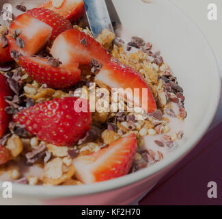 Strawberry smoothie bowl, with chocolate and granola Stock Photo