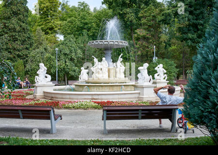 Fountain and statues in front of The Old Casino in Central Park Cluj Stock Photo