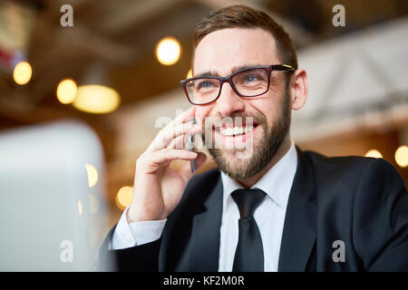Cheerful Businessman Using Smartphone Stock Photo