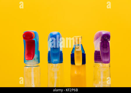 Cleaning spray bottle products on a bright yellow background Stock Photo