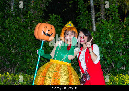 Halloween partygoers, girl dressed as pumpkin, at a Halloween event in Shenzhen, China Stock Photo