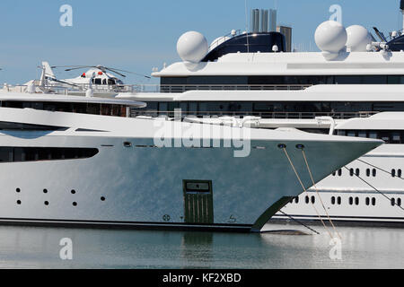 Luxury yacht with private helicopter, moored on harbor Stock Photo