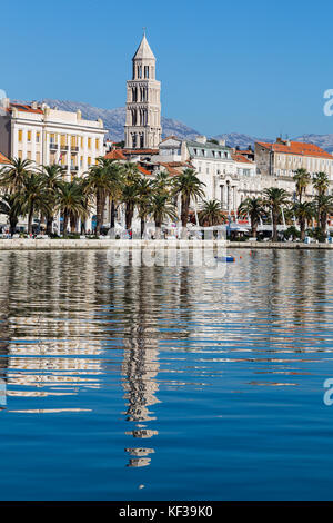 Cathedral of St Domnius reflects in the water off the tree-lined Riva on Split's waterfront.