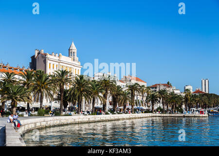 The pretty promenade along the harbour in Split known as the Riva - the trendy strip home to modern cafes greeting tourists who enter the city from bo Stock Photo