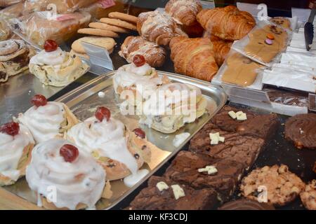 Cakes on sale in a bakery shop window Stock Photo