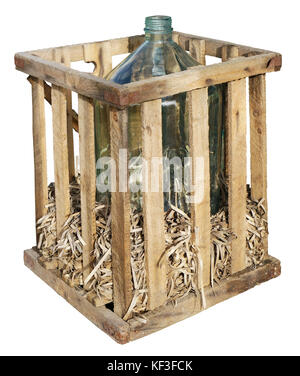 A huge glass bottle for a young wine in a wooden trellised box. Straw inside the container protects the container from impacts. Isolated on white with Stock Photo