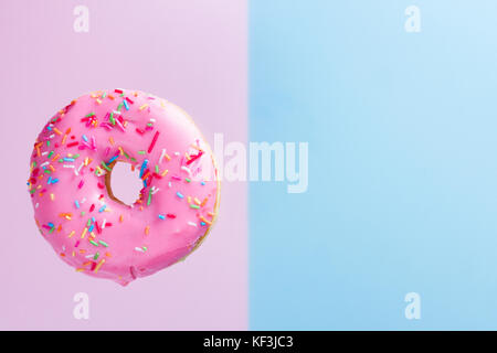 flying doughnuts on blue Stock Photo