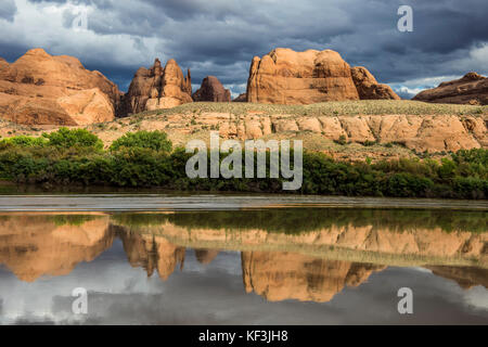 Sandstone rocks reflecting in the Colorado river, Canyonlands National Park, Utah, USA Stock Photo
