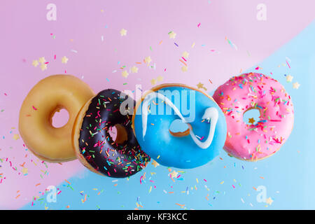 flying doughnuts on blue Stock Photo