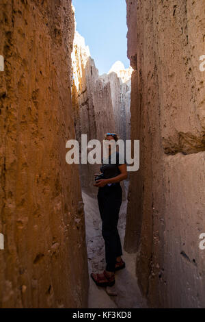 Woman standing in the sandstone chimneys in the Cathedral Gorge State Park, Nevada, USA Stock Photo