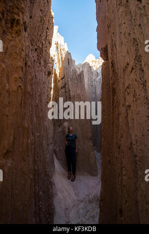 Woman standing in the sandstone chimneys in the Cathedral Gorge State Park, Nevada, USA Stock Photo