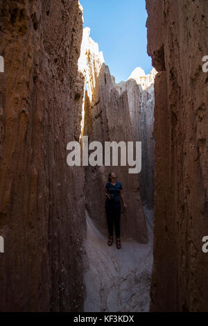 Woman standing in the sandstone chimneys in the Cathedral Gorge State Park, Nevada, USA Stock Photo