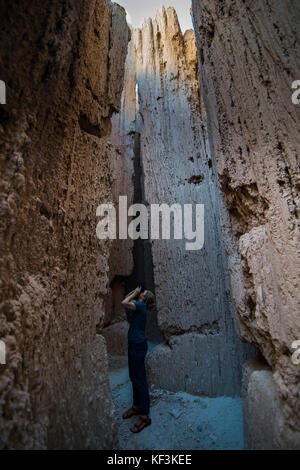 Woman standing in the sandstone chimneys in the Cathedral Gorge State Park, Nevada, USA Stock Photo