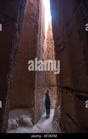 Woman standing in the sandstone chimneys in the Cathedral Gorge State Park, Nevada, USA Stock Photo