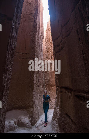 Woman standing in the sandstone chimneys in the Cathedral Gorge State Park, Nevada, USA Stock Photo