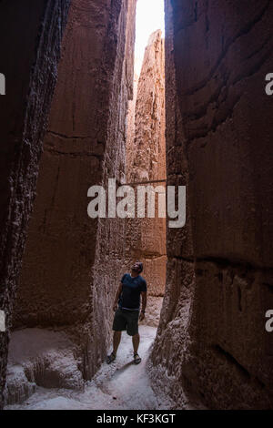 Woman standing in the sandstone chimneys in the Cathedral Gorge State Park, Nevada, USA Stock Photo