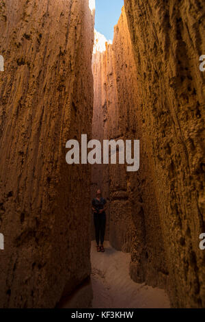 Woman standing in the sandstone chimneys in the Cathedral Gorge State Park, Nevada, USA Stock Photo