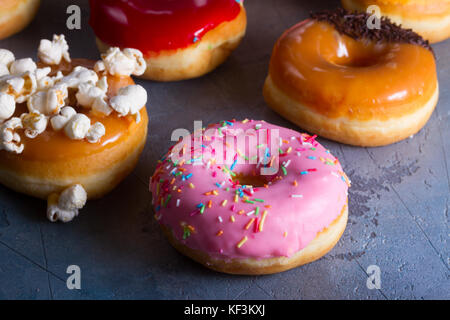 sweet doughnuts on gray stone background Stock Photo