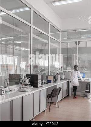 girl in an industrial laboratory tests on the quality of products Stock Photo