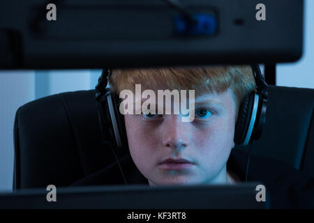 Close-up Of A Boy Working On Computer Stock Photo