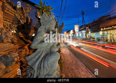 Jalan Raya Street illuminated at dusk. Ubud, Bali, Indonesia. Stock Photo