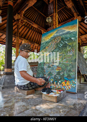 Balinese artist working at the Agung Rai Museum of Art (ARMA). Ubud, Bali, Indonesia. Stock Photo