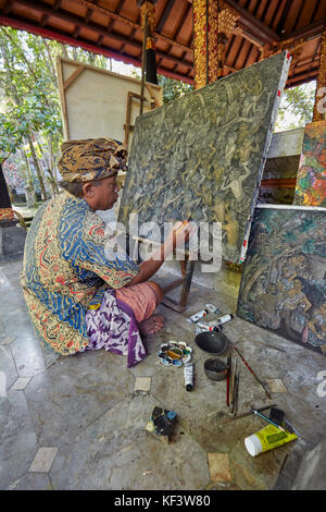 Artist working at the Agung Rai Museum of Art (ARMA). Ubud, Bali, Indonesia. Stock Photo