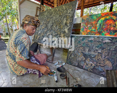 Artist working at the Agung Rai Museum of Art (ARMA). Ubud, Bali, Indonesia. Stock Photo