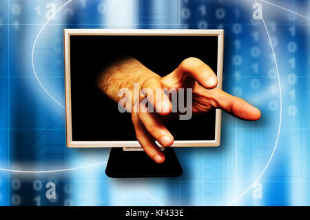 hand coming out of a computer monitor, grabbing gesture, identity theft or cyber crime concept Stock Photo