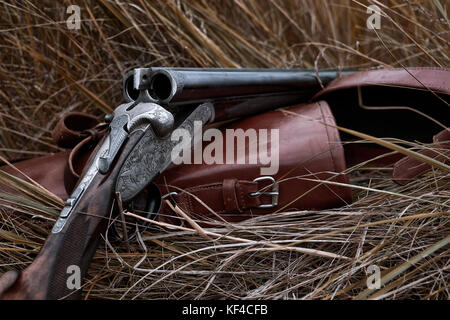 An old horizontal double-barrel in the autumn field Stock Photo