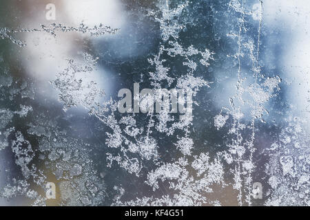 Frost pattern on window glass close up abstract background photo texture Stock Photo