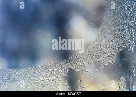Water condensation on window glass, closeup abstract background photo Stock Photo