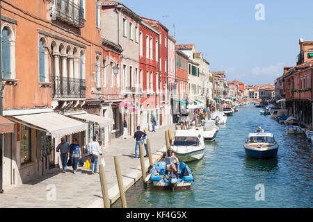 View down Rio dei Vetrai, Murano Island, Venice, Veneto, Italy with its colorful buildings and boats. Murano is known for its glass making. Stock Photo