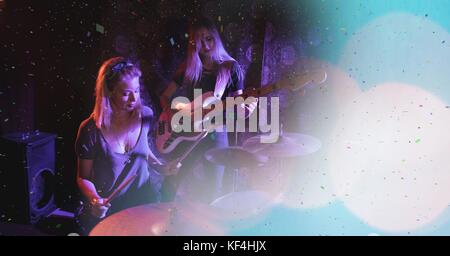 Digital composite of people playing at concert with transition Stock Photo