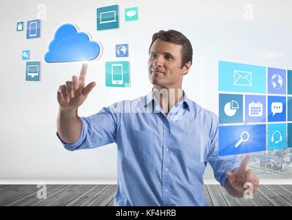 Digital composite of Apps interfaces and Businessman touching air in front of city Stock Photo
